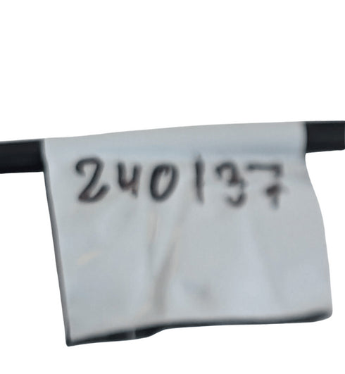 Close-up of a white label with black text on a white background